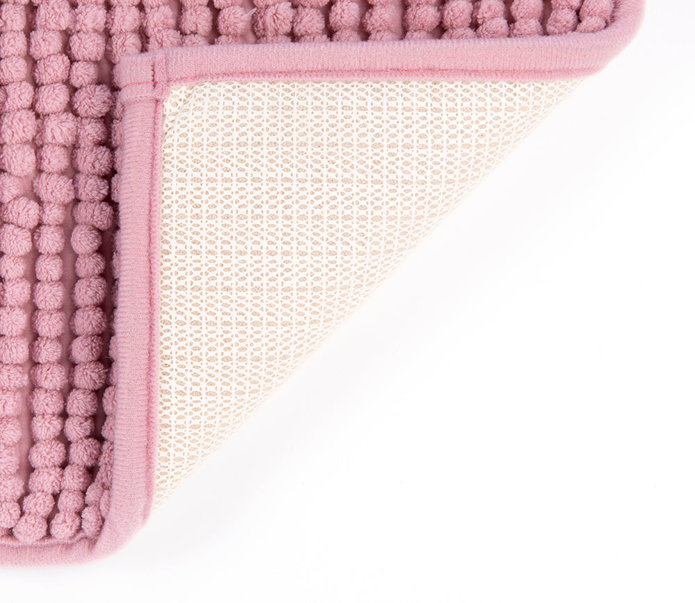 Auf diesem Bild befindet sich die rutschfeste Unterseite eines Badvorlegers aus Microfaser in der Farbe alt-rosa.