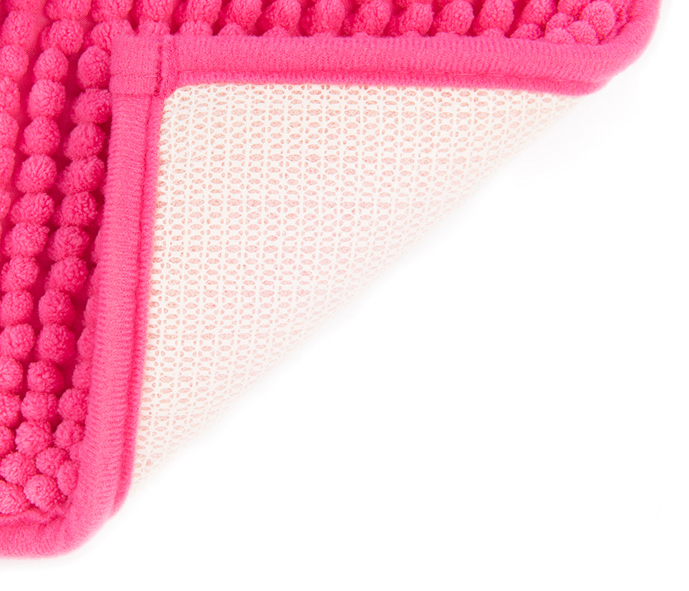 Auf diesem Bild befindet sich die rutschfeste Unterseite eines Badvorlegers aus Microfaser in der Farbe pink.